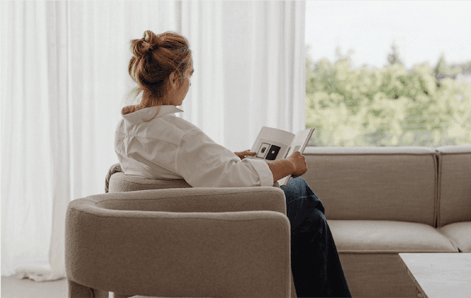Lady reading a book.